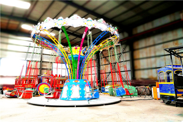 Attractive Hot Sale Fruit Wave Swinger for Kids with Beautiful Lights at Night