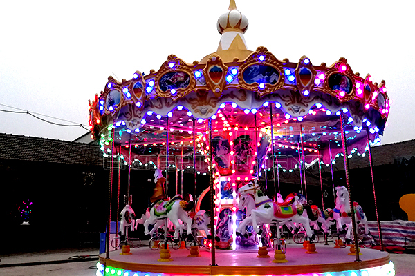 The Beautiful Carousel Rides with Colorful Lights at Night are Favored by Kids and Young People